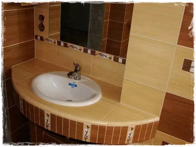 ívelt éptett mosdó